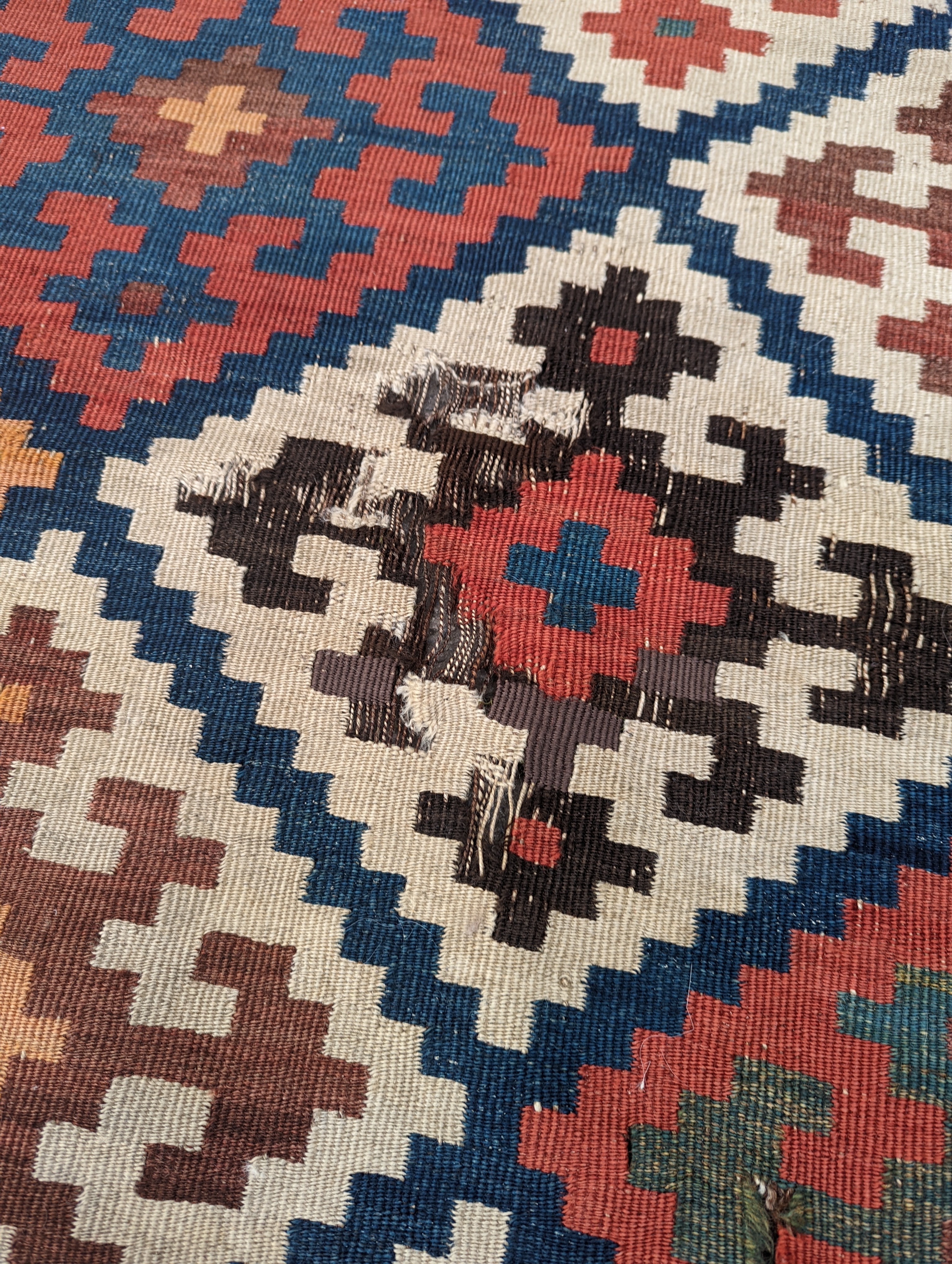 A Persian tribal Kelim carpet, 230 x 158cm and a Turkish bag
